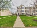 Desirable townhomes feature manicured lawns and inviting walkways at 170 Straughn Ln, Westfield, IN 46074