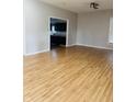 Bright and airy living room with hardwood floors and an open layout connecting to the kitchen at 1922 N Cherry St, Columbus, IN 47201