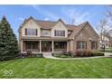 Charming two-story home with manicured lawn, covered porch, brick accents, and classic curb appeal at 20251 Dayspring Ct, Noblesville, IN 46062