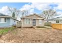 Charming single-story home with light siding, updated windows, and a secure front entrance at 2055 N Somerset Ave, Indianapolis, IN 46222