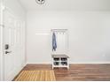 Inviting entryway featuring a coat rack with shoe storage and a bright, clean aesthetic at 2416 Meadow Bend Dr, Columbus, IN 47201