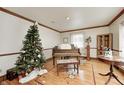 Bright living room with hardwood floors, vintage details, and a decorative christmas tree at 3360 E Main St, Danville, IN 46122