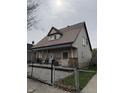 Lovely home with a cozy porch and a well-kept front yard at 408 N Colorado Ave, Indianapolis, IN 46201