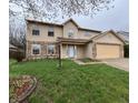 Inviting two-story home with a well-maintained lawn and tasteful landscaping enhancing its appeal at 5814 Lakefield Dr, Indianapolis, IN 46254