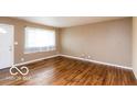 The hardwood floors complement the room's natural light at 5838 W Henry St, Indianapolis, IN 46241
