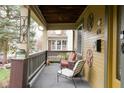Inviting front porch with comfortable seating, classic decor, and views of the neighborhood street at 616 N Bancroft St, Indianapolis, IN 46201