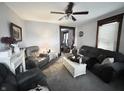 Inviting living room with plush seating, a ceiling fan, and neutral decor at 640 W South St, Shelbyville, IN 46176