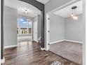 Elegant foyer featuring hardwood floors, arched doorway, and abundant natural light, creating a welcoming ambiance at 682 Keswick Dr, Brownsburg, IN 46112