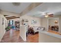Inviting living room with wood floors, neutral walls, and a cozy seating area; flows to the dining area and other rooms at 758 Stafford Rd, Plainfield, IN 46168