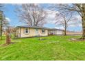 Charming one-story home with a well-maintained lawn and inviting curb appeal at 7764 S State Road 109, Markleville, IN 46056