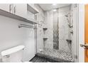 Modern bathroom featuring a glass-enclosed shower with decorative tile and updated fixtures at 923 Jonathan Dr, Plainfield, IN 46168