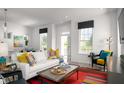Bright living room with white walls, modern decor, and comfortable seating at 998 Kinzer Ave, Carmel, IN 46032