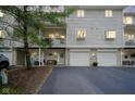 Inviting townhome featuring a private balcony, individual garage, and charming curb appeal at 1127 Island Woods Dr # 56, Indianapolis, IN 46220