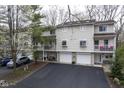 Charming two-story townhome with private balconies, individual garages, and well-maintained landscaping at 1127 Island Woods Dr # 56, Indianapolis, IN 46220