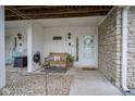 Welcoming front porch with bench seating, a decorated wreath, and a charming, cozy ambiance at 1127 Island Woods Dr # 56, Indianapolis, IN 46220