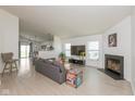 Bright and open living room with modern flooring, fireplace, and neutral decor, creating a welcoming atmosphere at 12722 Brady Ln, Noblesville, IN 46060