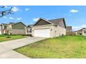 A single Gathering home with an attached two car garage and a large lawn at 1407 Allen Ct, Shelbyville, IN 46176