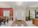 Inviting foyer with tiled flooring, decorative lighting and contrasting wall colors at 1484 N County Road 900 E, Avon, IN 46123