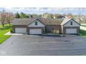 Three-car garage with ample parking space on a paved driveway at 1484 N County Road 900 E, Avon, IN 46123