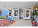 Inviting covered porch with comfortable seating and cheerful decor, perfect for relaxing outdoors at 15129 Smithfield Dr, Westfield, IN 46074