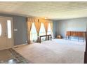 Inviting living room featuring neutral carpet, stylish furnishings, and ample natural light at 243 E Benton St, Alexandria, IN 46001
