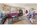 Comfortable living room with a large patterned rug and a relaxing seating area at 3024 N Huber St, Indianapolis, IN 46226