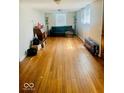 Open living room featuring wood floors and lots of natural light at 3126 Newhart St, Indianapolis, IN 46217