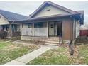 Classic home featuring a welcoming front porch and well-defined architectural design at 330 N Beville Ave, Indianapolis, IN 46201