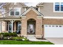 Charming home featuring brick accents around the front entryway and a well-maintained lawn at 3393 Paisley Pointe, Whitestown, IN 46075