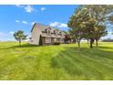 Spacious two-story home with lush green lawn, brick accents, and mature trees at 4545 W 200 S, Lebanon, IN 46052
