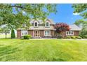 Charming two-story home with brick accents, lush lawn, and beautiful landscaping at 4545 W 200 S, Lebanon, IN 46052