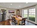 Inviting dining room with natural light, wooden table, and comfortable seating at 5311 Larita Ln, Anderson, IN 46017