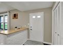 Inviting entryway features a wooden countertop on a painted brick base, adding rustic charm at 5311 Larita Ln, Anderson, IN 46017