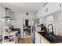 An efficient kitchen featuring white cabinets and modern appliances at 5427 E 19Th St, Indianapolis, IN 46218