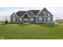 Charming home featuring a beautifully designed exterior with a manicured lawn and inviting front porch at 5679 S 675 W, New Palestine, IN 46163