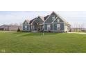 Lovely home with a well-maintained lawn, accented by white trim and a covered front porch at 5679 S 675 W, New Palestine, IN 46163