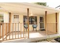 Cozy front porch with railing, seating, and a view of the yard at 5820 Bonnie Brae St, Indianapolis, IN 46228