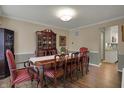 Formal dining room featuring a large wooden table, chairs, and hardwood floors at 6037 Porter Ln, Noblesville, IN 46062