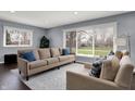 Comfortable living room featuring large windows, neutral tones, and plush seating at 6377 Green Leaves Rd, Indianapolis, IN 46220