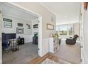 Open-concept space featuring a home office and a view into a bright living area at 6557 Eagles Nest Ln, McCordsville, IN 46055