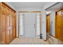 Bright entryway with a closet, neutral tile flooring, and sidelights flanking the front door at 760 Sable Ridge Dr, Greenwood, IN 46142