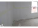 Bright bedroom with a large window and freshly painted walls ready for personalization at 10027 Redwood Peak Ln, Indianapolis, IN 46259