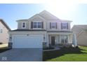 Charming two-story home with a two-car garage, stone accents, and well-maintained landscaping at 10027 Redwood Peak Ln, Indianapolis, IN 46259