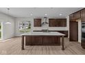 Modern kitchen featuring a large island, stainless steel appliances, and ample cabinet space at 10543 Banyan Wood Ct, Indianapolis, IN 46239