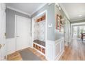Well-organized foyer with a built-in bench and storage space with decorative baskets at 12507 Doe Ln, Indianapolis, IN 46236