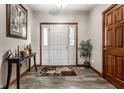 Inviting entryway with a neutral color scheme, stylish wood flooring, and natural light at 1513 Tottenham Dr, Danville, IN 46122