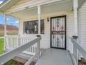 Inviting front porch with decorative security door, creating a charming and secure entry at 1816 N Moreland Ave, Indianapolis, IN 46222