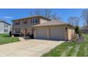 Two-story home with brick accents and two-car garage at 2328 Discovery Dr, Anderson, IN 46017