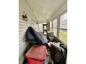 Enclosed porch with windows, offering natural light and additional space at 26 N Holmes Ave, Indianapolis, IN 46222