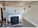 Cozy living room featuring a classic fireplace and modern flooring at 2706 Country Estates Dr, Indianapolis, IN 46227